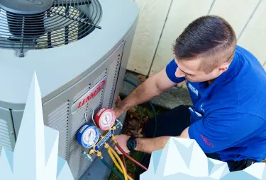 Arctic Air Conditioning technician performing HVAC maintenance