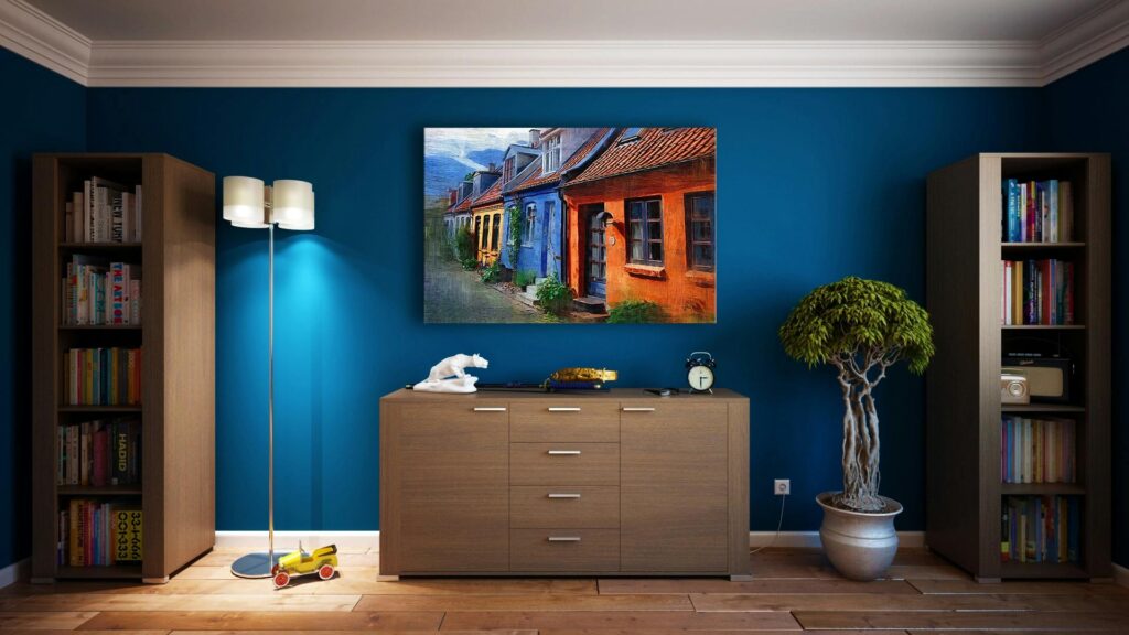 living room with painting on blue wall