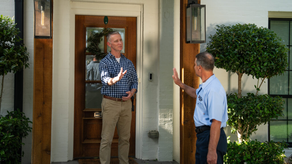 Arctic Air Conditioning greeting customer at home