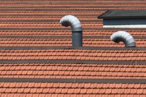 Plumbing vent on top of a house's roof