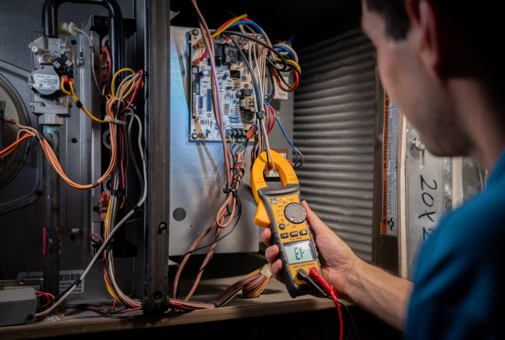 HVAC Repair Tech Working on a System