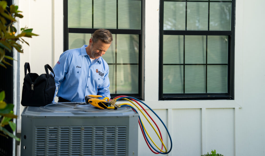 AC Repair Tech Fixing an HVAC Unit