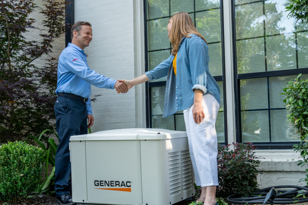 Arctic Air HVAC tech shaking hands with Generac Generator Client