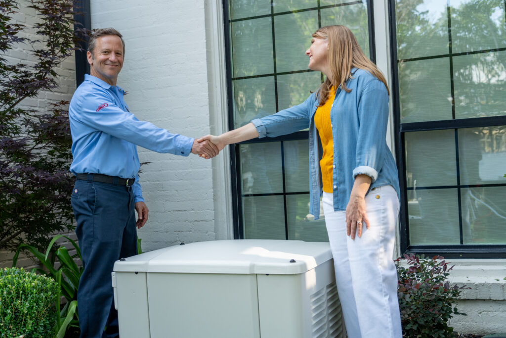 Arctic Air Generator Tech Shaking Hands with Client