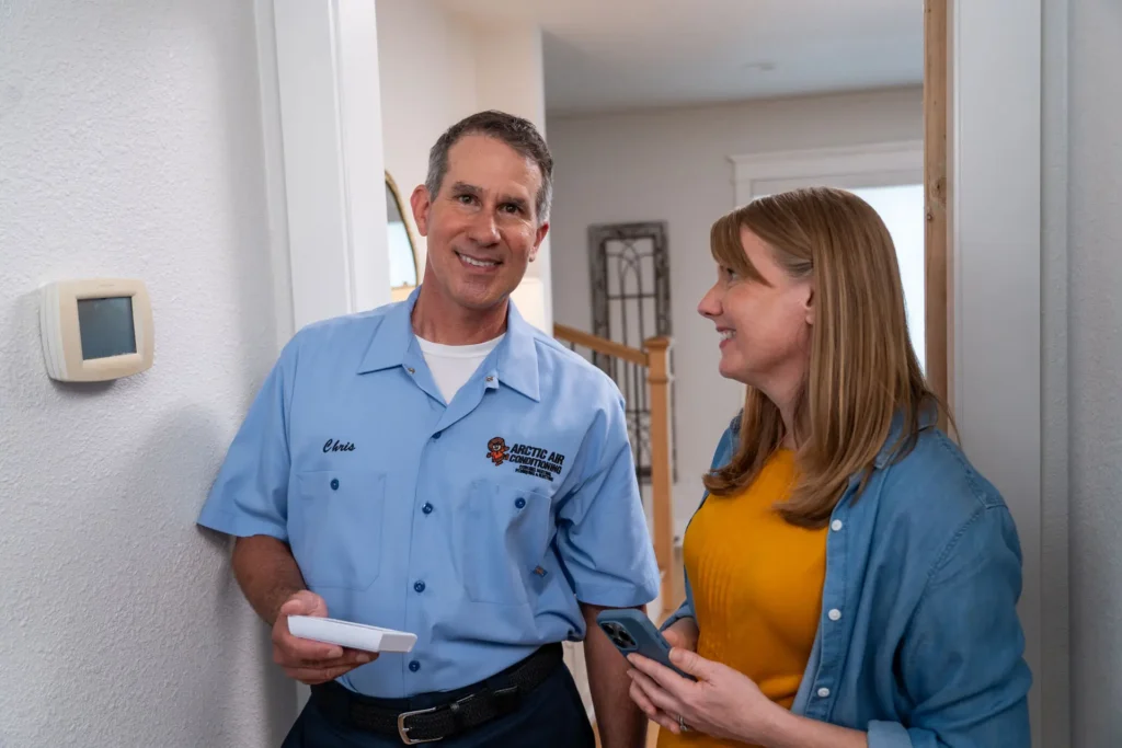 HVAC tech working with customer