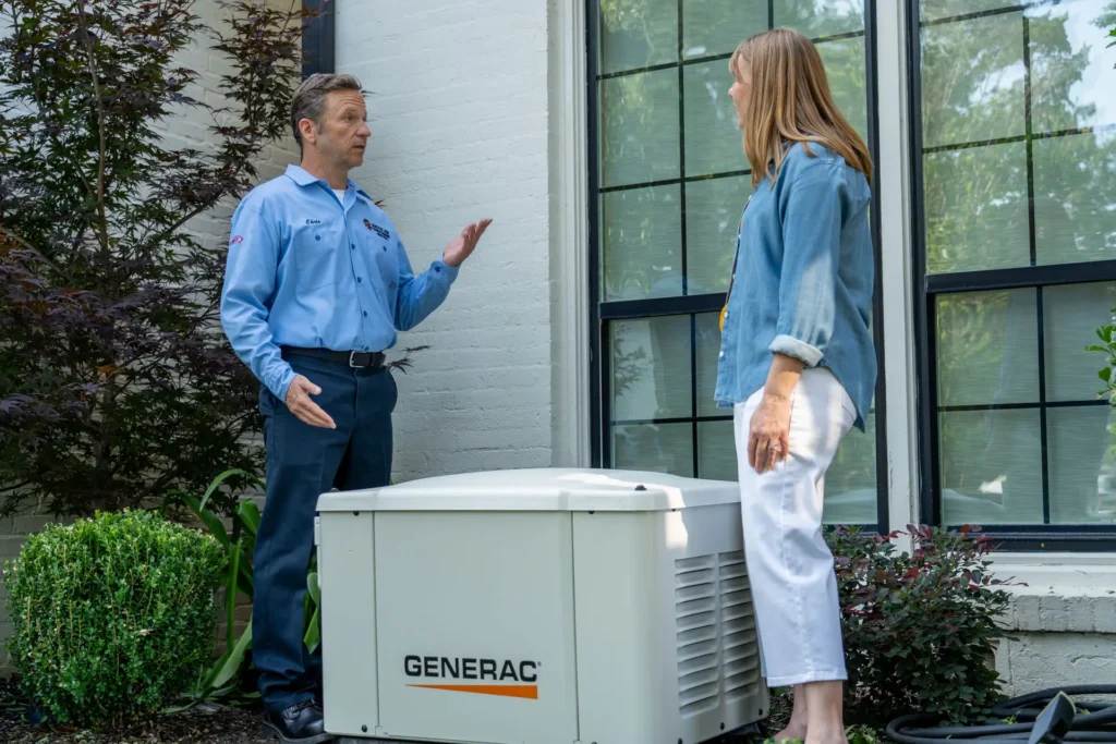 electrician explaining a generator to customer