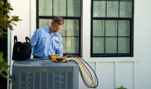 AC Repair Tech Fixing an HVAC Unit